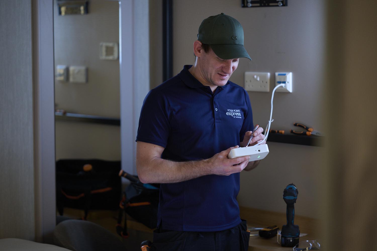 maintenance person repairs a socket