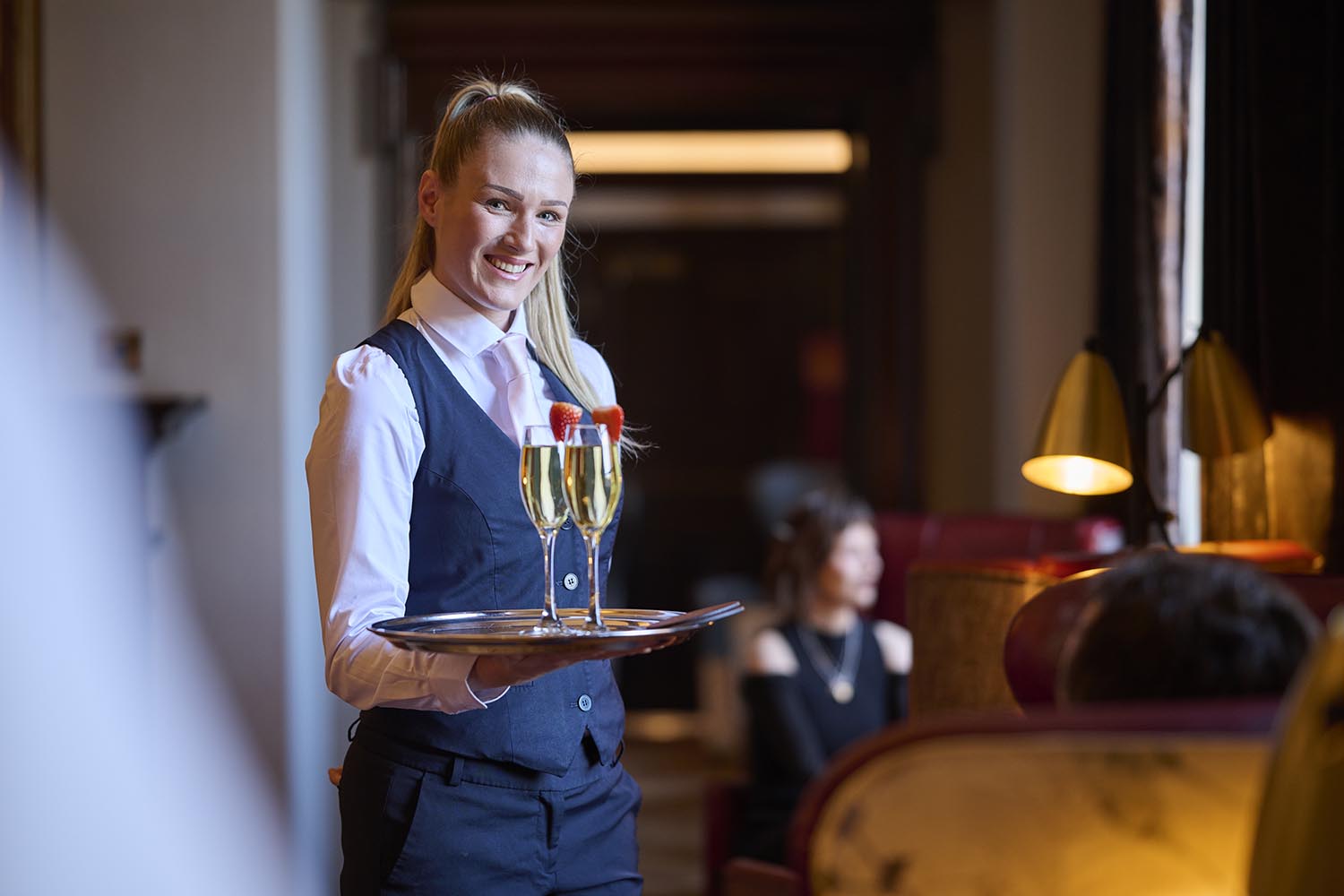 waitress serving champagne